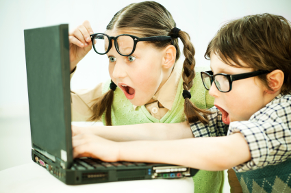 Students looking at a laptop