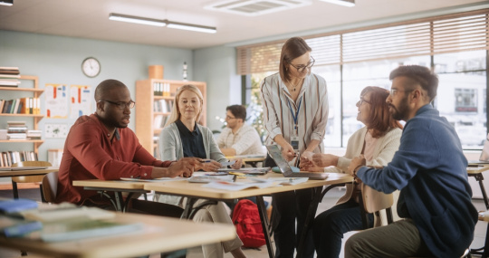 A team of teachers discuss how to best integrate an education technology solution in to their classrooms.