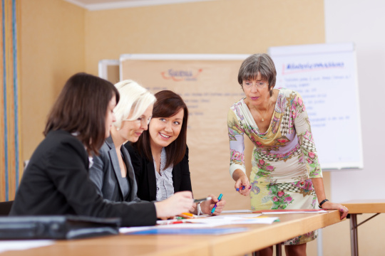 Senior teacher in a meeting with colleagues