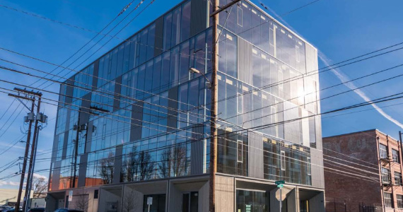 Photograph of our new building taken from across the street. 