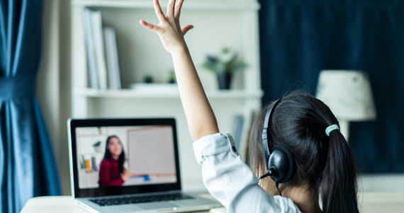 Girl Raising Hand During Virtual Math Class