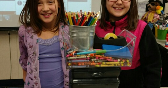 Two girls doing a STEM experiment in the classroom