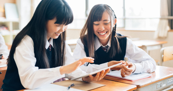 School Girls Using a Digital Tablet in Class
