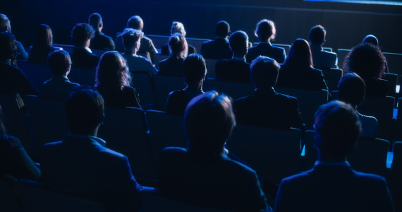 People looking at a stage.