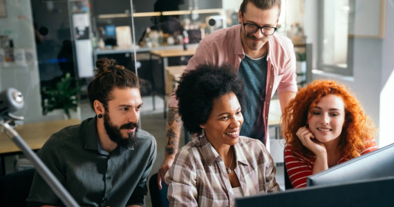Team of education IT professionals brainstorming ideas. 