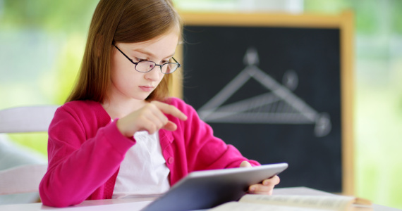 Girl using math app in classroom