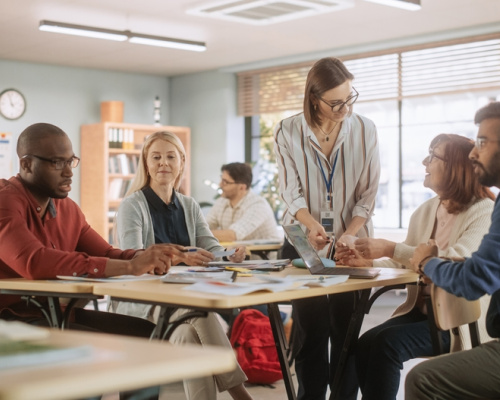 A team of teachers discuss how to best integrate an education technology solution in to their classrooms.