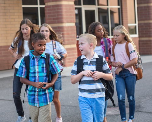 Diverse children walking and talking