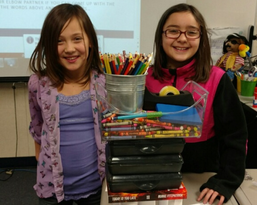 Two girls doing a STEM experiment in the classroom