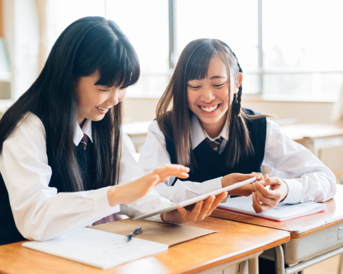 School Girls Using a Digital Tablet in Class