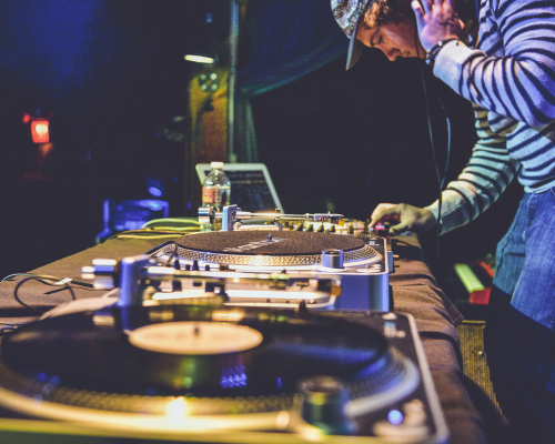 Kevin Horstmann photo of deejay leaning over turn table