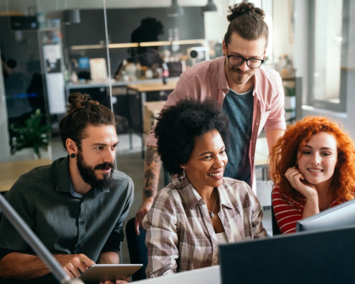 Team of education IT professionals brainstorming ideas. 