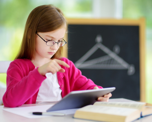 Girl using math app in classroom